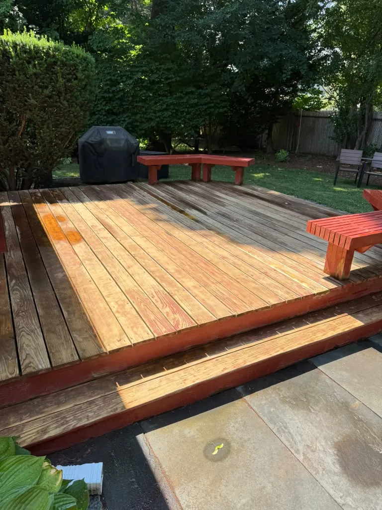 Freshly stained wood deck after exterior painting in Greater Boston, MA